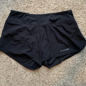 Brooks black size L running shorts.